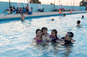 people swimming in the Ted Watkins Park pool.