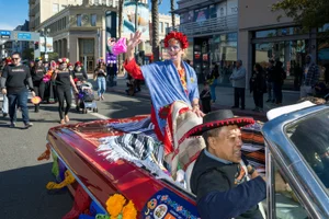 Supervisor Hahn waving from a car at the LB Muertos Parade