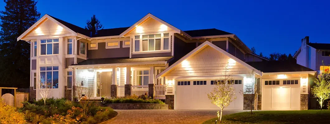 Luxury house at dusk in the midwest. How to Find the Best Homeowners Insurance in Chalco, Nebraska.