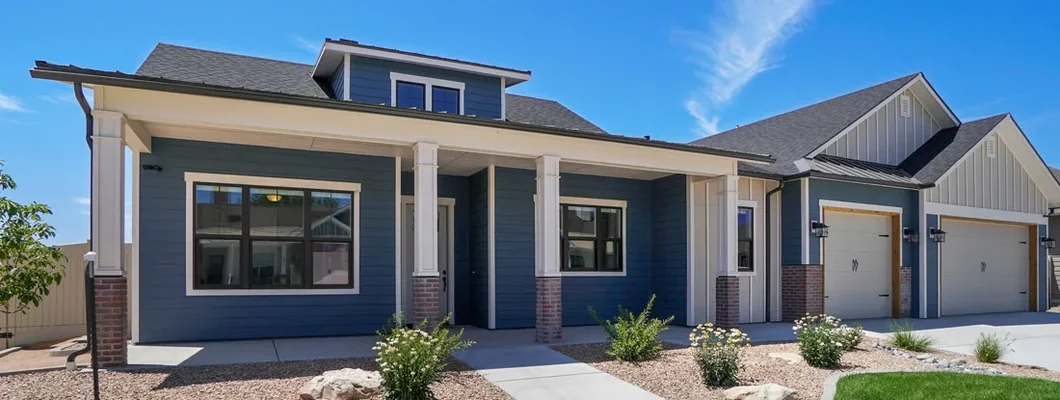 Modern blue and white home with landscaping. Leawood, Kansas Homeowners Insurance. 