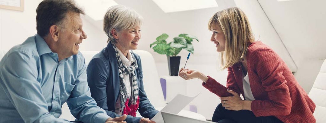 Couple Meeting with Financial Advisor. Variable Annuity Features.