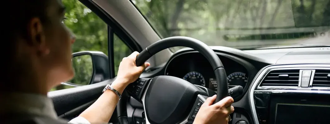 Close up of man driving car in Arkansas. Find Bentonville, Arkansas car insurance.