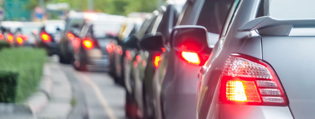  Car in traffic on road in Macon, Georgia. Find Macon, Georgia car insurance.