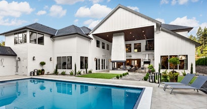 Swimming Pool in Backyard Exterior of Extraordinary Luxury Home. Why Did My Homeowners Insurance Go Up In 2025?