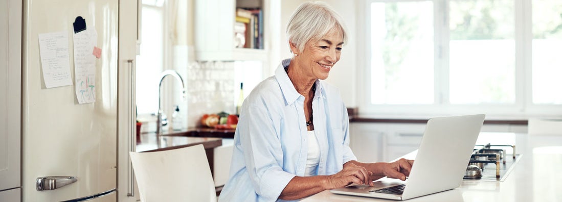 senior woman using a laptop at home