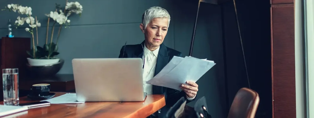 Mature Businesswoman In Her Office. What is Errors and Omissions Insurance?