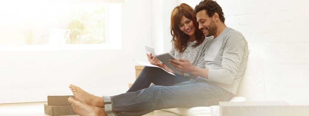 Couple discussing monthly expenses. Variable Annuity Accumulation Units.