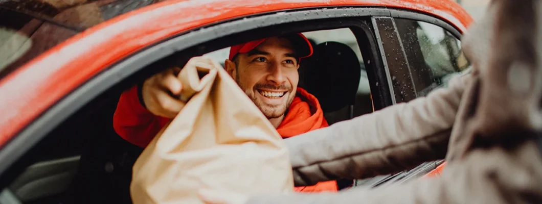 Delivery man delivering an order. Find Oklahoma Commercial Vehicle Insurance.