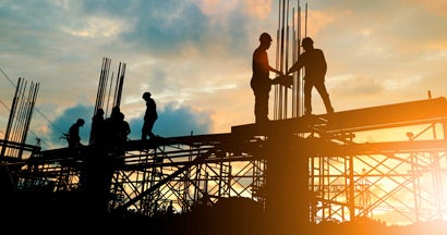 Engineer and construction team working at site. Find Builders Risk Insurance.