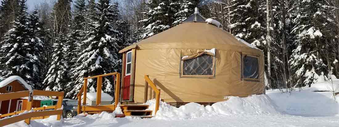 Yurt in a Snowy Evergreen Setting. Find Yurt Insurance.