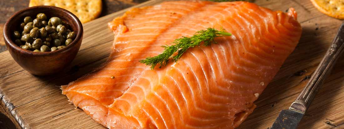 Smoked Salmon Appetizer with Crackers and Capers. Find Alaska Restaurant Insurance.