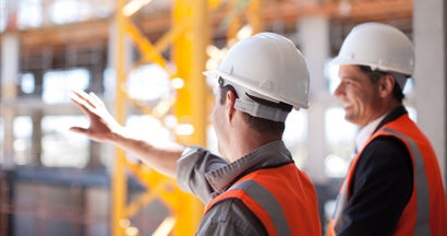 Construction workers working on construction site. Finding the Right Construction Insurance.