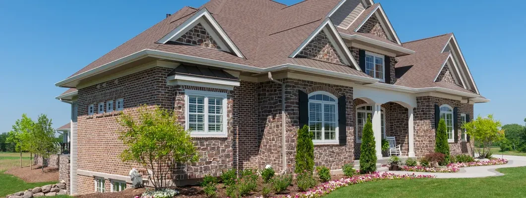 Stone and Brick Suburban House. How to Find the Best Homeowners Insurance Policy in Scarsdale, NY.
