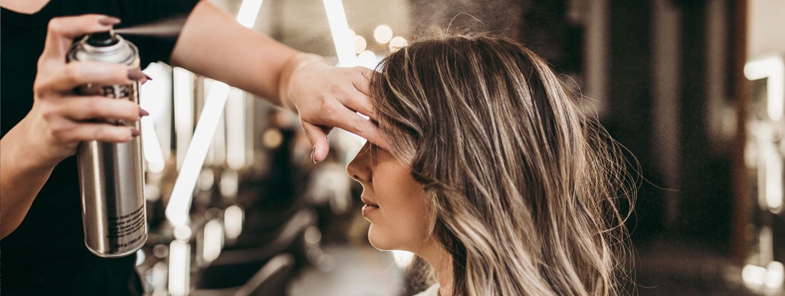 Woman in salon. Find Massachusetts Hair Salon Insurance.