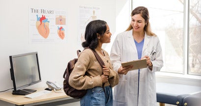 Female doctor talks to female college student. Doctor and Patient Confidentiality for Teens and Adolescents.