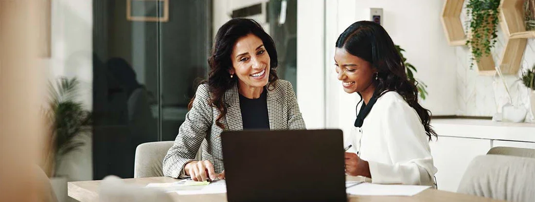 Professional women meeting with laptop in office. Find Accountants Professional Liability Insurance.