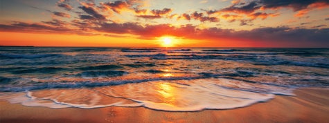 Sunrise on the beach and beautiful cloudscape over the sea