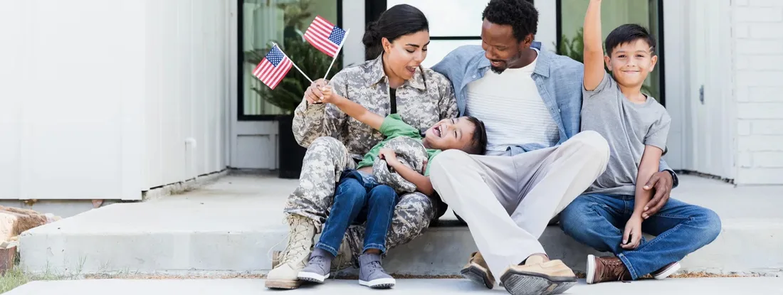 Female soldier is excited to be home with her family. Find Military and Veteran Home Discounts.