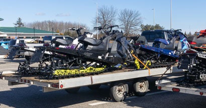 Trailer with snowmobile. How to Transport Your Snowmobile Legally.