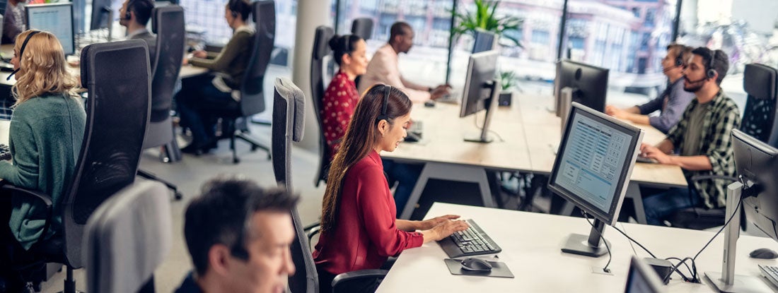 Modern, open-plan call center or office environment with multiple workstations. Alabama Employment Practices Liability Insurance.