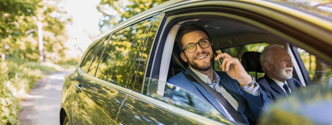 Business colleagues traveling to a business meeting together. How to Find the Best Car Insurance Coverage in Biddeford, Maine. 