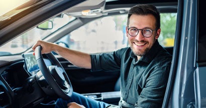 Happy customer buying a new car. Pros and Cons of Buying a Car with Cash.