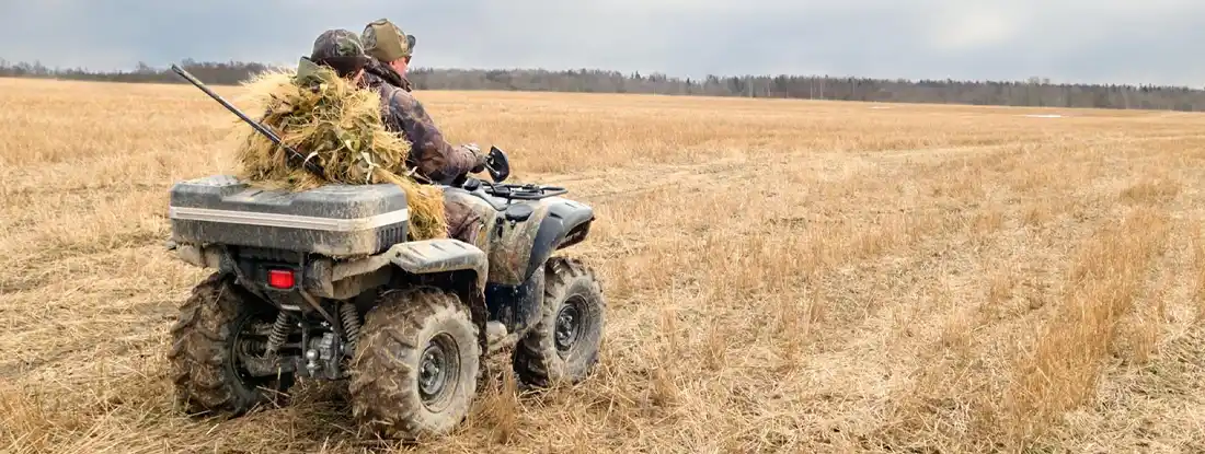 Hunters on quad bikes. 6 ATV Safety Tips Big Game Hunters Should Know.