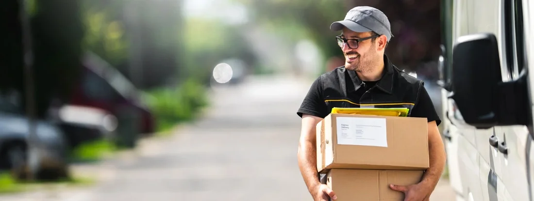 Man delivering a package to a customer. Find Vermont Commercial Vehicle Insurance. 