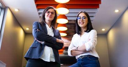 Woman getting insurance advice in office from agent. Why work with an independent agent in West Virginia.