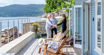 Landlord showing a mature couple rental house. Why Landlord Insurance Is Essential on Vacation Rental Homes. 