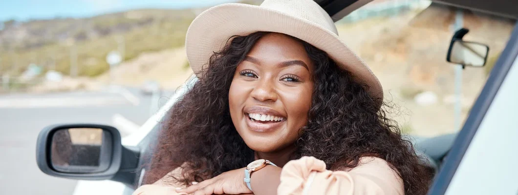 Happy face of woman in car. What Insurance is Needed for a Leased Car?
