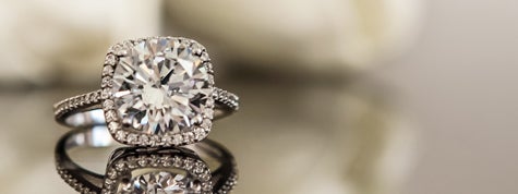 White gold wedding ring on flower background