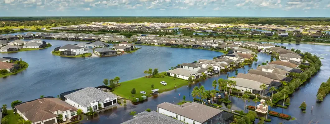 Flooded houses from Hurricane Debby rainfall water in residential community in Sarasota, Florida. Does Home Insurance Cover Hurricanes and Flood Damage?