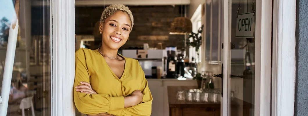 Business entrepreneur welcoming you to the opening of her coffee shop. Business Insurance in Metairie, Louisiana.