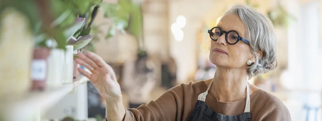Senior woman working in a small flower store. Carrington, North Dakota Business Insurance. 