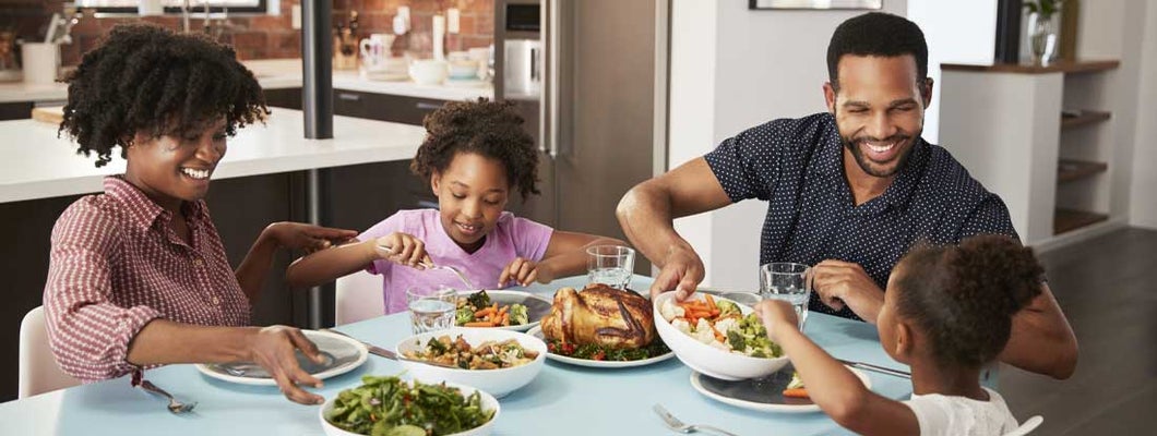 Family Enjoying Meal Around Table At Home Together. What is a life annuity?