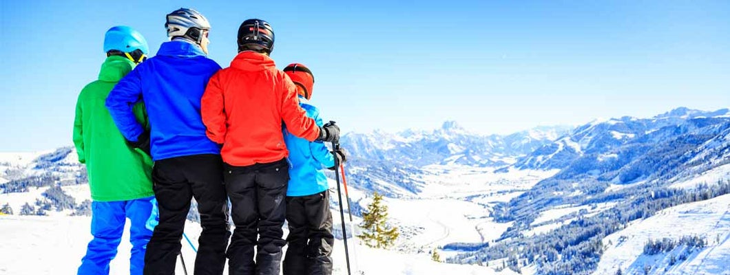 Family of four skiing in Vail