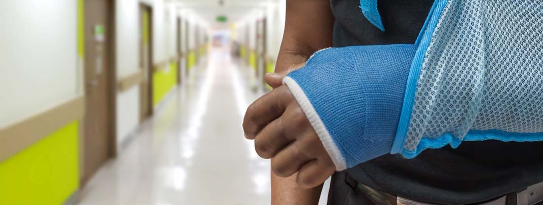 Person's arm in a blue orthopedic cast and a sling. Find Individual disability insurance plans.