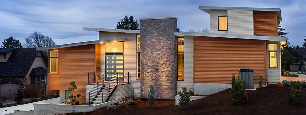 Facade of home with deep blue evening sky. Scarborough, Maine Homeowners Insurance. 