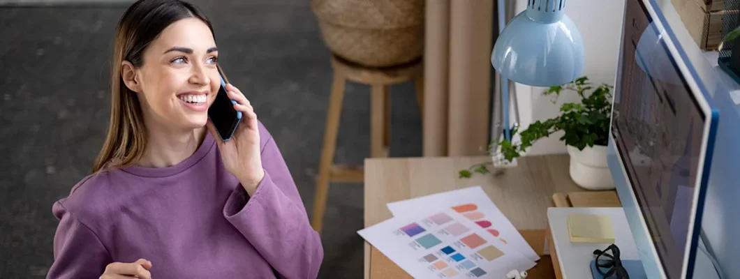 Woman entrepreneur working from home. Find Essex, Vermont business insurance.