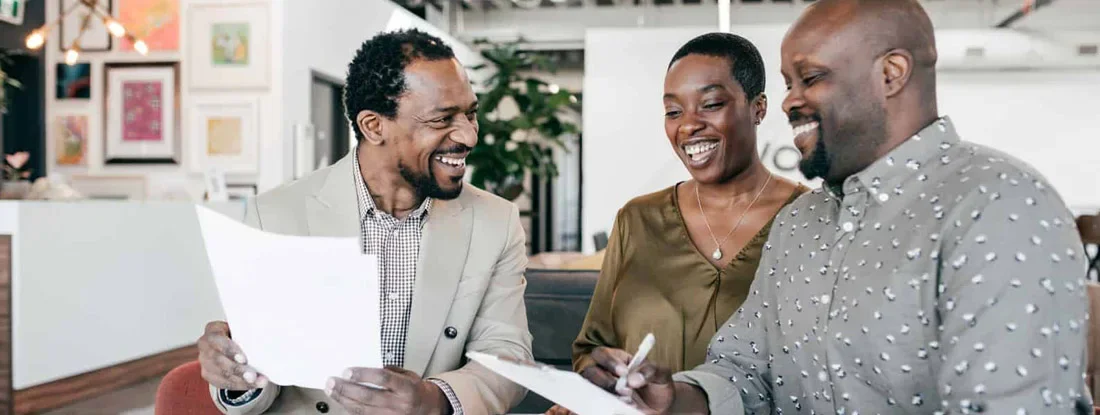 Business meeting with financial advisor. Find Mississippi Landlord Insurance.