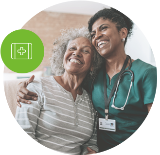 Home care healthcare professional hugging elderly patient.