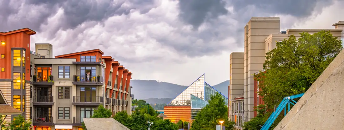Chattanooga, Tennessee downtown walking path and cityscape at twilight. Find Tennessee Renters Insurance.