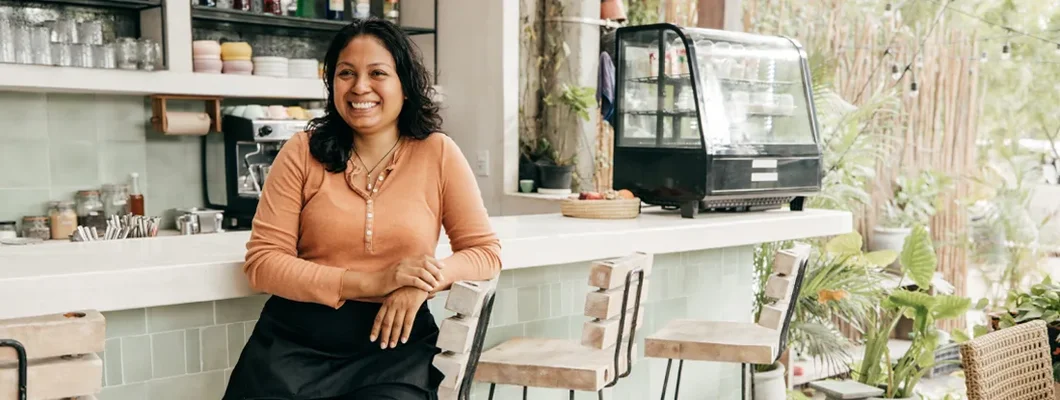 Business owner in outdoor cafe. How to Find the Best Business Insurance in North Liberty, Iowa.