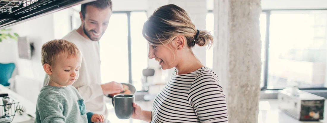 Young family preparing breakfast together in their kitchen. Find New Jersey Life Insurance.