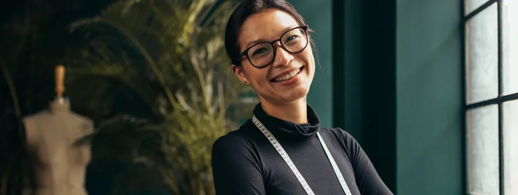 Young female designer smiling. Scarborough, Maine Business Insurance. 
