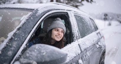 Young woman on a winter journey. The 5 Best All-Wheel Drive and Four-Wheel Drive Cars.