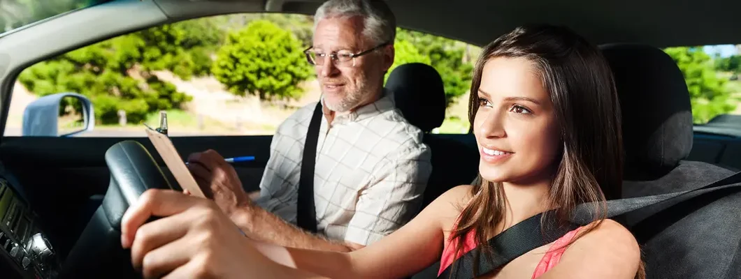 Student driving car with instructor. How to Find the Best Car Insurance in Metairie, Louisiana.