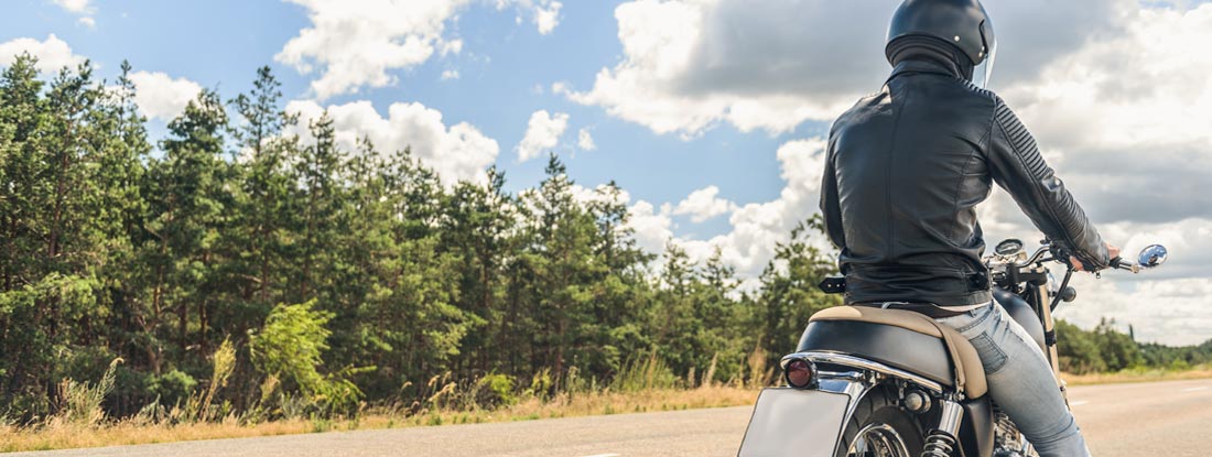 Man driving motorcycle. Find Motorcycle Insurance.