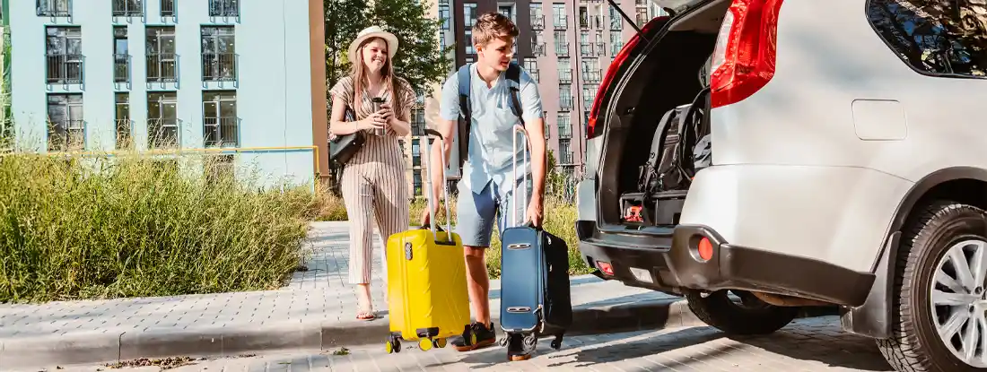 Couple gathering for road trip. Rental Car Insurance: Is It Worth It? 